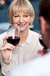 Couple Sipping Red Wine And Cherishing Memories Stock Photo