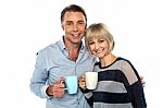 Couple Starting Their Day With A Cup Of Coffee Stock Photo