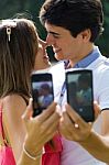 Couple Taking Photo Of Themselves With Smart Phone On Romantic P Stock Photo