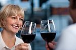 Couple Toasting In A Restaurant Stock Photo