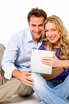 Couple Using Digital Tablet Stock Photo