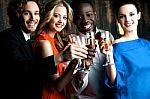 Couples Enjoying Champagne Or Wine At A Party Stock Photo