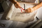 Creative Architect Projecting On The Big Drawings In The Dark Lo Stock Photo