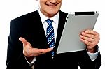 Cropped Image Of A Businessman Holding Tablet Pc Stock Photo