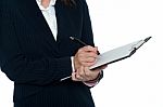 Cropped Image Of Female Secretary Taking Notes Stock Photo