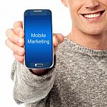 Cropped Image Of Man Displaying Smart Phone Stock Photo