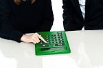 Cropped Image Of Teacher And A Student Operating Calculator Stock Photo