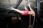 Crossfit Rope Climb Training On A Dark Background Stock Photo