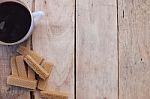 Cup Of Coffee And Wafers On The Wood Background Stock Photo