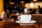 Cup Of Coffee On Table In Cafe Stock Photo