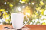 Cup Of Coffee On Wooden Stock Photo