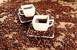 Cups With Coffee And Coffee Beans Stock Photo