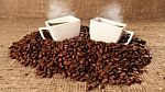 Cups With Coffee And Coffee Beans Stock Photo