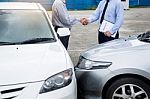 Customer Shake Hand With Auto Insurance Agents After Agreeing To Stock Photo