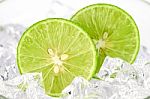 Cut Lime (citrus Aurantifolia (christm.)  Swingle) And Ice On Wh Stock Photo