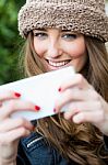 Cute Brunette Woman Taking Photo Of Herself On The Street Stock Photo