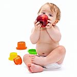 Cute Infant Boy With Apple Stock Photo