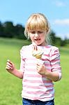 Cute Little Girl Eating Ice Cream Stock Photo