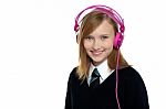 Cute Teenager Listening To Music Through Headphones Stock Photo