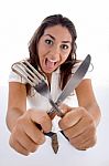 Cute Teenager Showing Cutlery Stock Photo