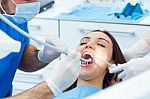 Cute Young Woman At The Dentist. Mouth Checkup Stock Photo