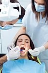 Cute Young Woman At The Dentist. Mouth Checkup Stock Photo