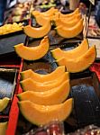 Cutting Japanese Melon Stock Photo