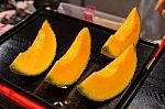 Cutting Japanese Melon Stock Photo