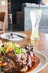 Delicious Barbecued Ribs And Lemon Soda Drink Stock Photo