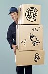 Delivery Man Carrying A Cardboard Boxes Stock Photo