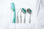 Dental Tools In Dentist Pocket Stock Photo