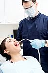 Dentist Examine On A Female Patient Stock Photo