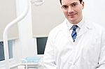 Dentist In His Modern Clinic Stock Photo