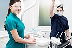 Dentist Setting Up Equipments In Clinic Stock Photo