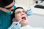 Dentist Treat A Man Teeth Stock Photo