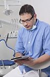 Dentists Using Digital Tablet Stock Photo