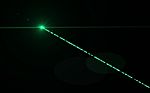 Digital Green Lens Flare In Black Background Stock Photo