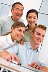 Diverse Group Of Happy People Looking Computer Stock Photo