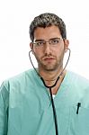 Doctor With Stethoscope In His Ears Stock Photo