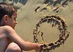 Drawing In The Sand Stock Photo