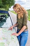 Dutch Woman Reading Road Map On Car Hood Stock Photo