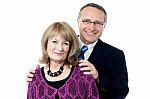 Elderly Couple Smiling To The Camera Stock Photo