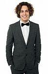 Elegant Man In Tuxedo Posing Over White Stock Photo