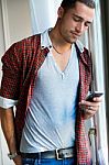 Elegant Young Handsome Man With Mobile Phone Stock Photo