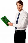 Employee Using Big Green Calculator Stock Photo