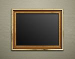 Empty Golden Vintage Frame On Wallpaper Background Stock Photo