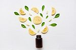 Empty Medicine Bottle With Fresh Lemon, Leaves And Vitamin C Stock Photo