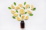 Empty Medicine Bottle With Fresh Lemon Slices And Leaf Stock Photo