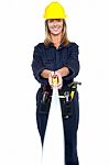 Engineer Woman Stretching Measuring Tape Stock Photo