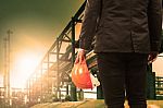 Engineering Man And Safety Helmet Standing Against Beautiful Lig Stock Photo